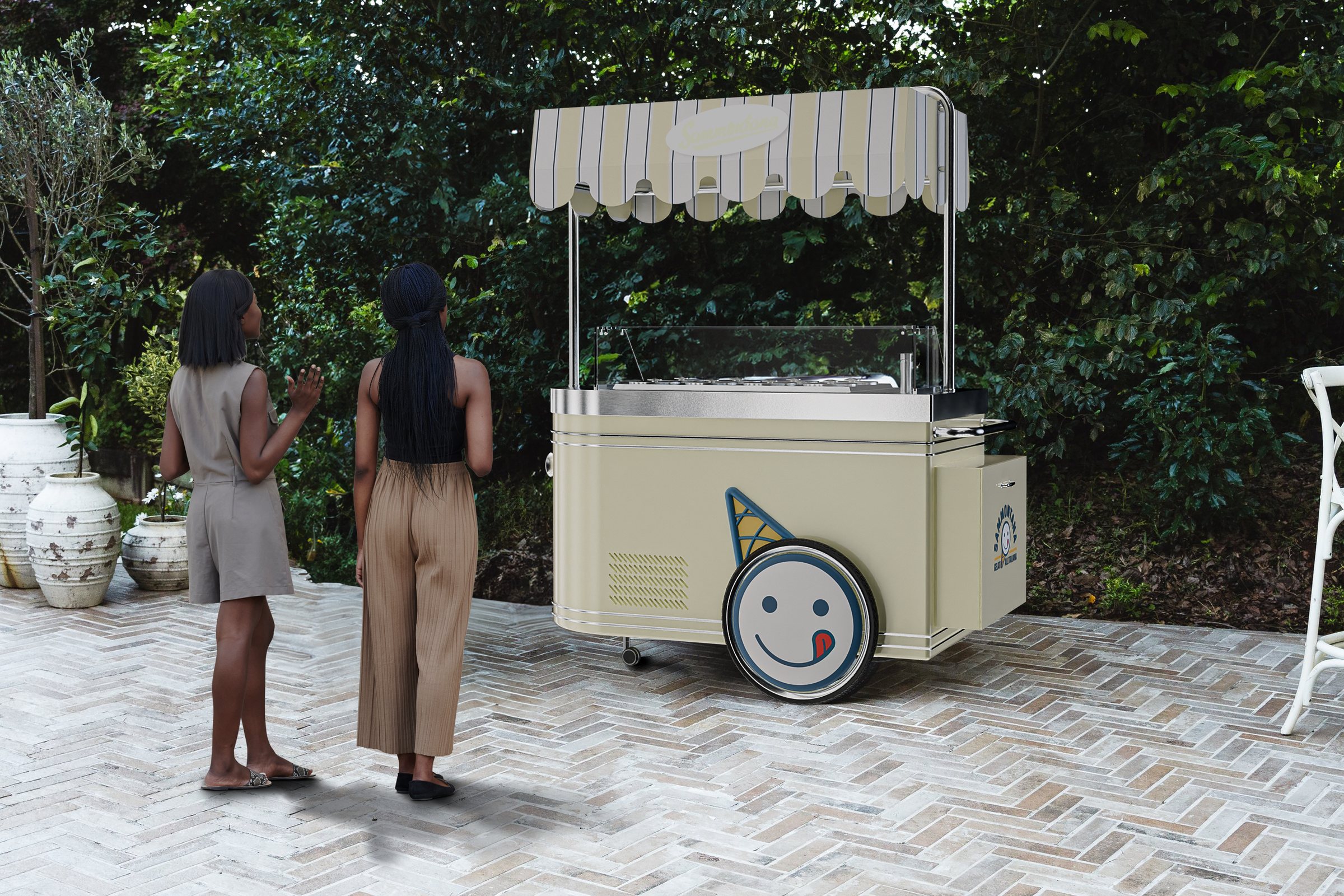 Two women looking at the Carretto Classic in a garden