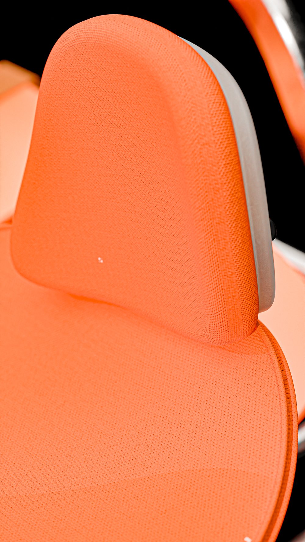 Close-up of an ergonomic orange cushion
