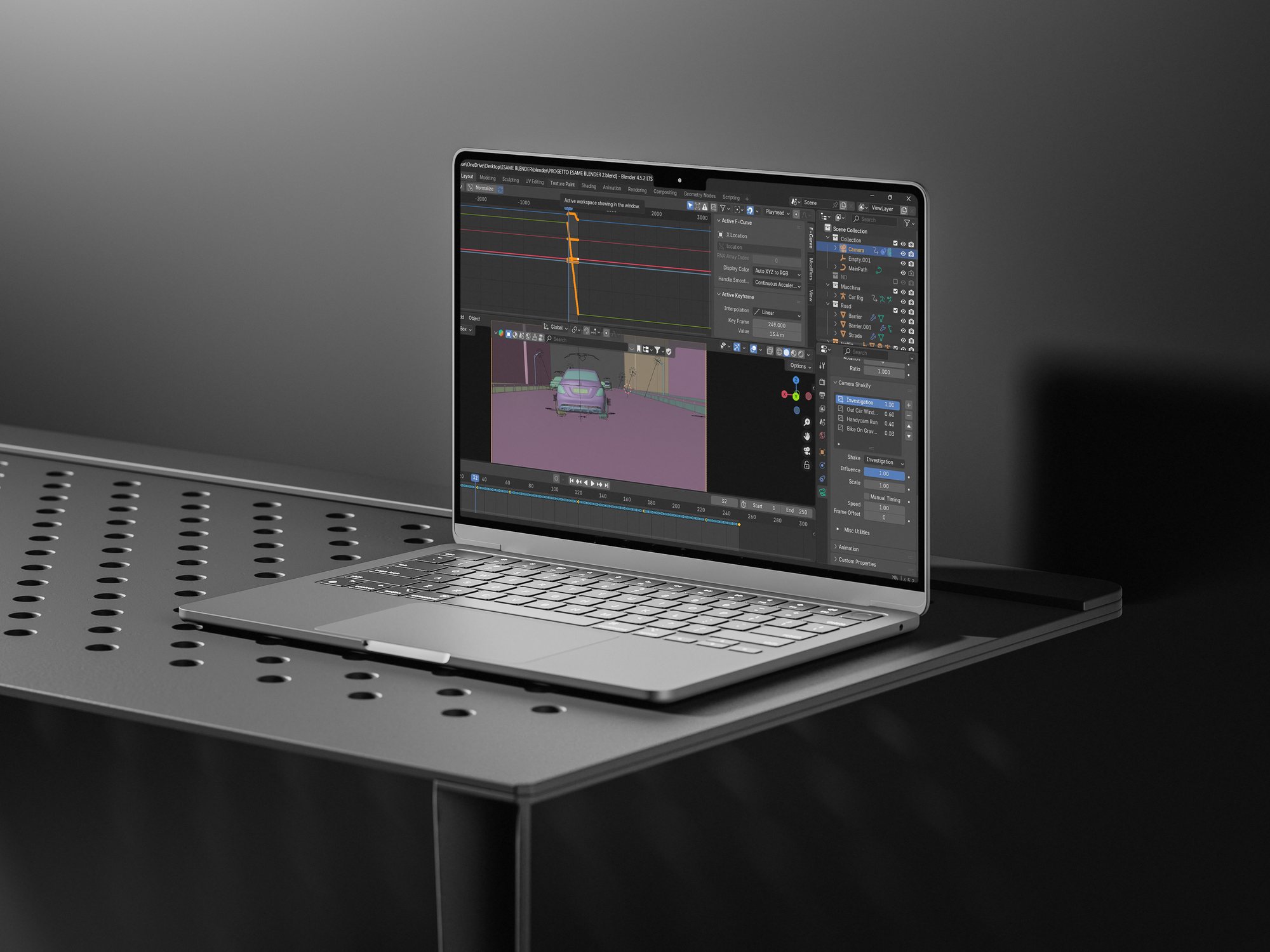 Laptop showing the Mercedes scene in Blender